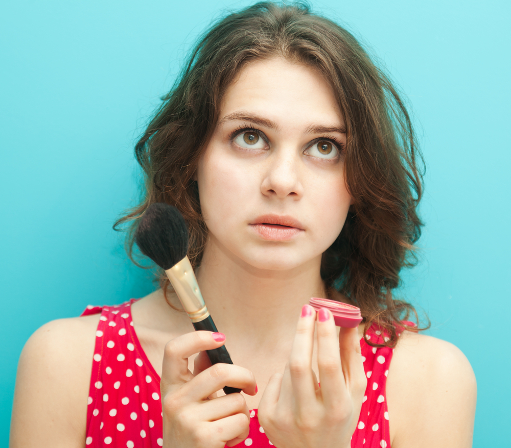 woman with makeup products