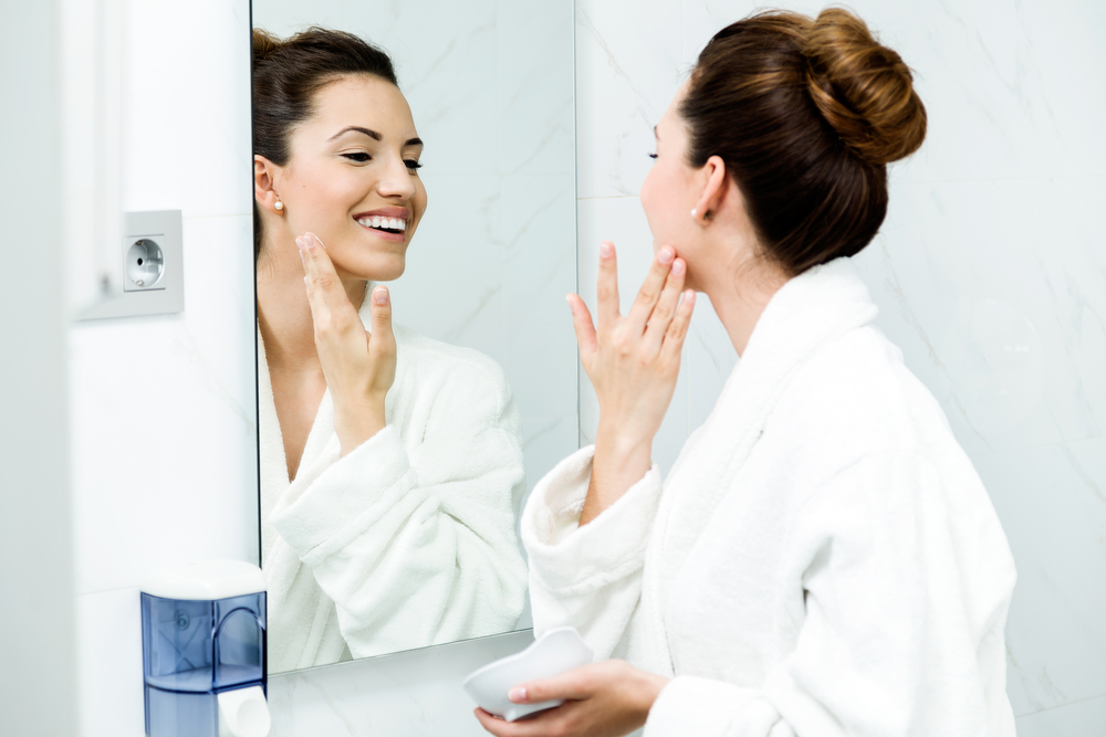woman skincare mirror
