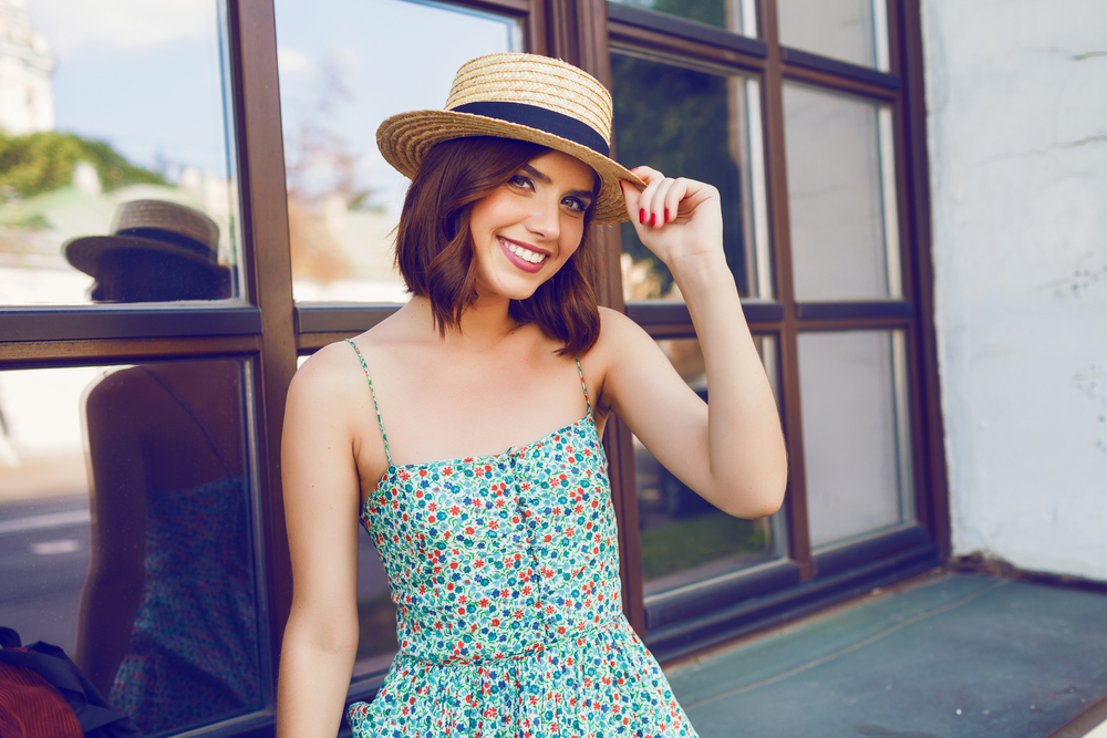 woman in sun dress and hat